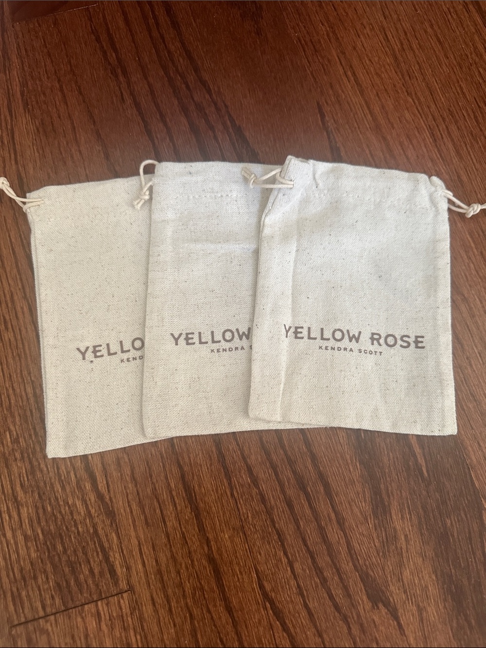 3 Yellow Rose by Kendra Scott Linen jewelry bags